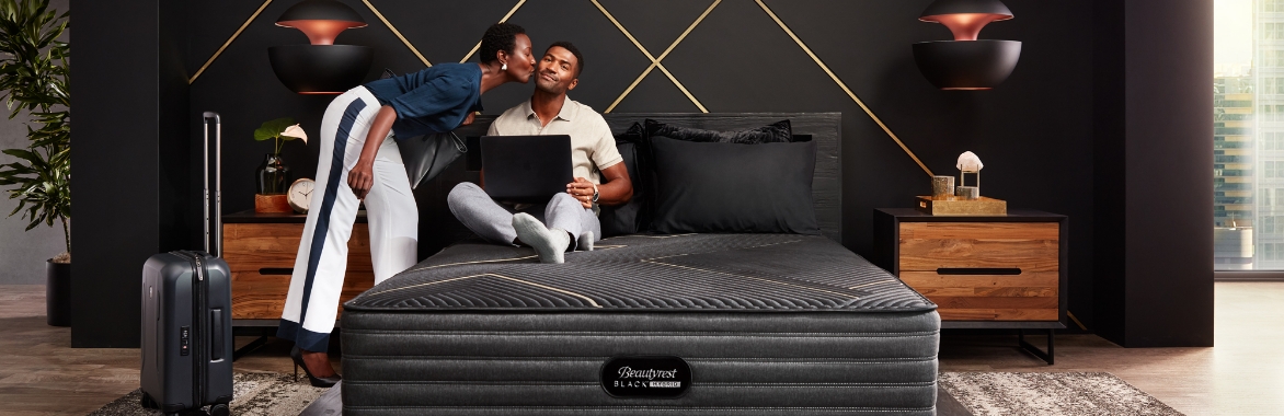 couple on beautyrest black mattress